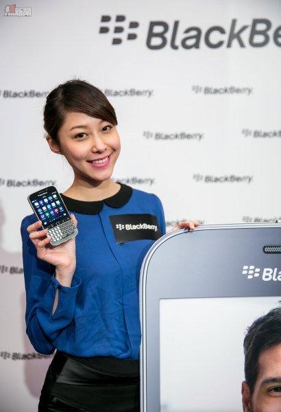 Female model holding BlackBerry Classic