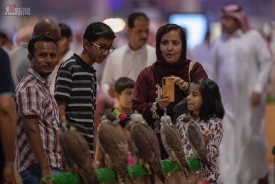 Visitors attending the 2nd Saudi Falcons and Hunting Exhibition - Riyadh, Saudi Arabia